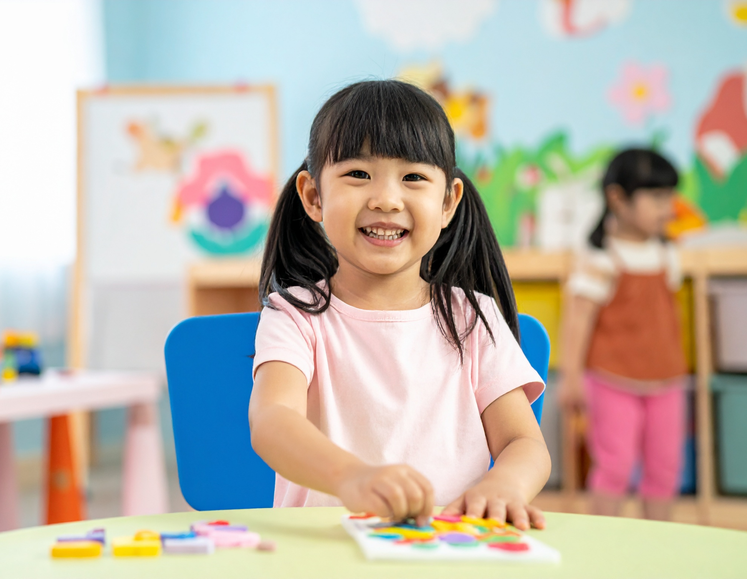 Girl at table playing with a puzzle
